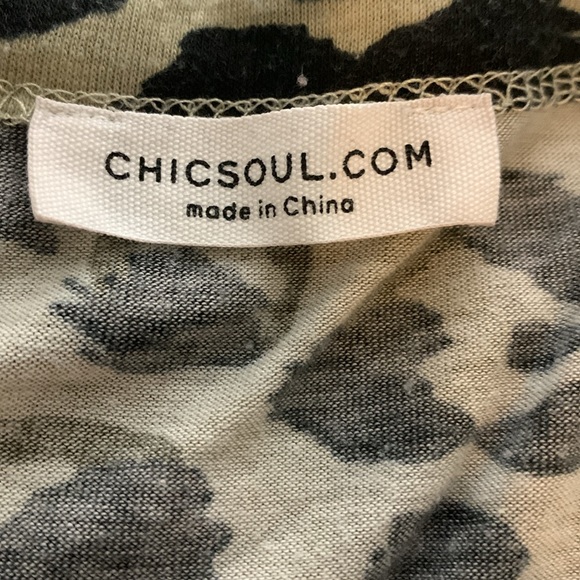 Woman’s long sleeve animal print babydoll top with rounded neckline. - Picture 7 of 8